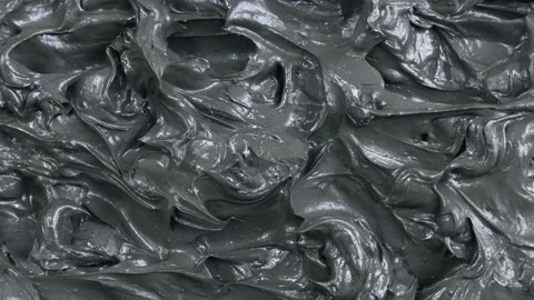 Black clay and mud face mask smooth creamy texture smudge circle rotation Stock Footage 235660921