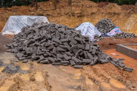 Black clay bricks for building at construction site Fotos de archivo