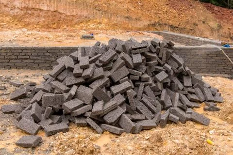 Black clay bricks for building at construction site Fotos de archivo