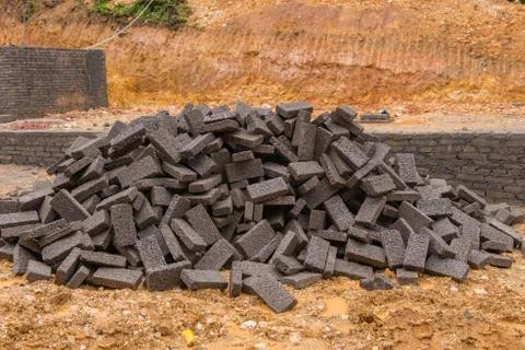 Black clay bricks for building at construction site 写真素材
