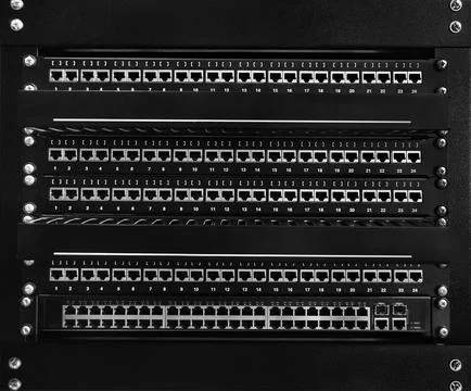 Black clean communication patch panel RJ45 for computer networks LAN, empty w Stock Photos