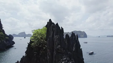 Black cliffs in Lagoon on the islands, Palawan, boats Philippines. Drone view Stock Footage 271725616