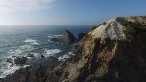 Black cliffs by the ocean Stock Footage 81215611