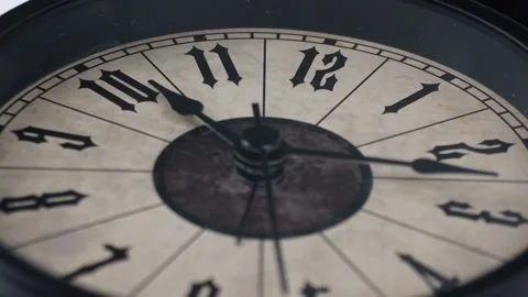 Black clock lying on the table. Stock Footage 230114624
