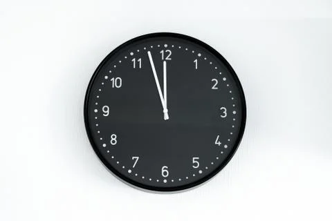 Black clock on wall Stock Photos
