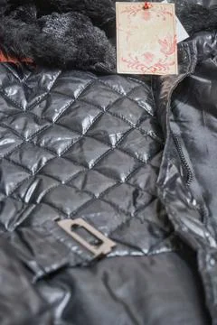 Black close-up jacket with a stitch in the shape of a diamond, Clean label. Stock Photos
