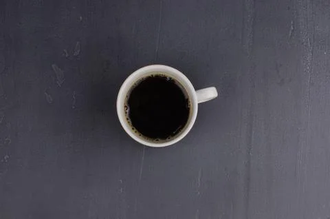 Black closeup on dark backdrop. Coffee espresso on dark background. Stock Photos