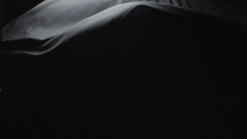 Black Cloth Floating down on a stark backdrop Stock Footage 87764841
