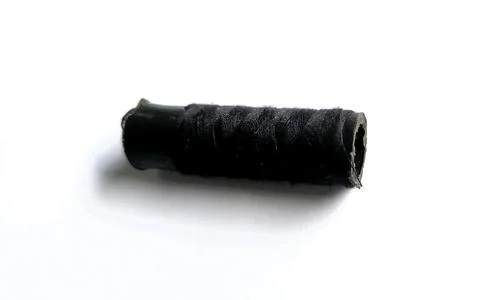 Black cloth thread that is still rolled up Foto stock