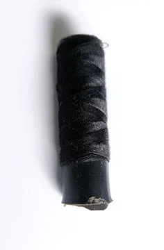Black cloth thread that is still rolled up Foto stock