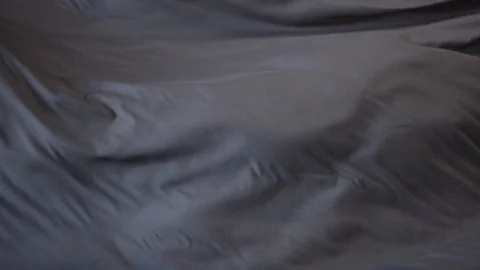 Black Cloth waving on a white background in slow motion 240fps Stock Footage 87764761