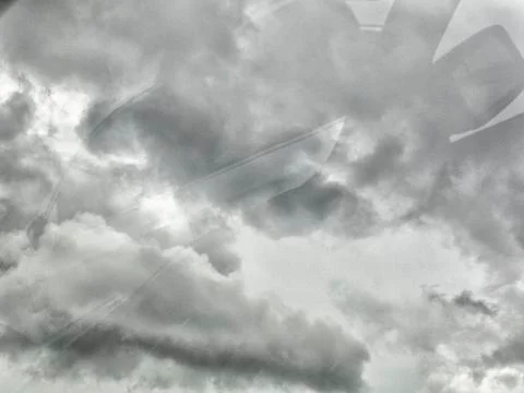 Black cloud before rainy. Black cloud background. Shot from car mirror. Proce Fotos de archivo