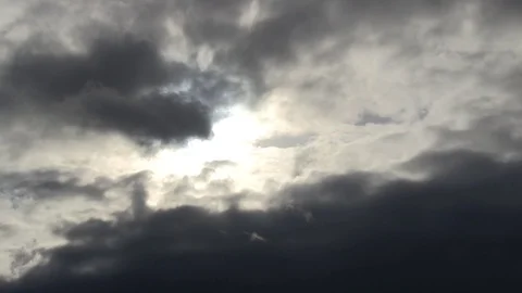Black cloud, sun shines through Stock Footage 93780793