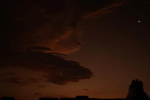 Black clouds and small moons Foto stock
