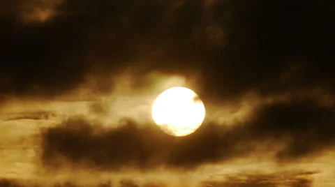 Black clouds cover the rising sun. Time-lapse Stockbeeldmateriaal 44287715