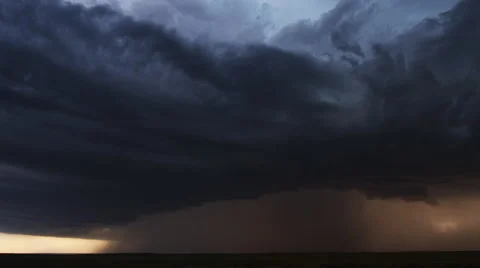 Black clouds dumping torrential rain on prairie amid multiple lightning flashes, Stock Footage 59514090