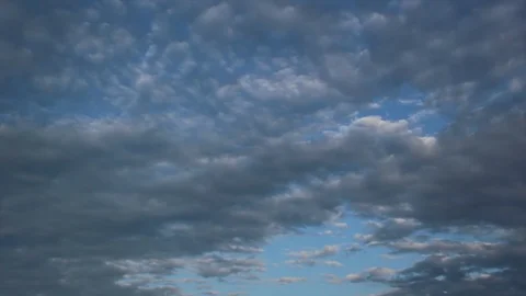 Black clouds floating under the blue sky Stock Footage 115524857