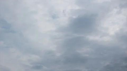 Black clouds floating under the blue sky Stock Footage 115541256