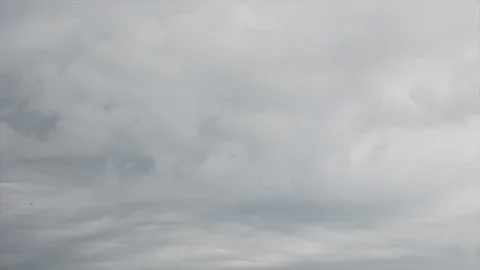 Black clouds floating under the blue sky Stock Footage 115541790