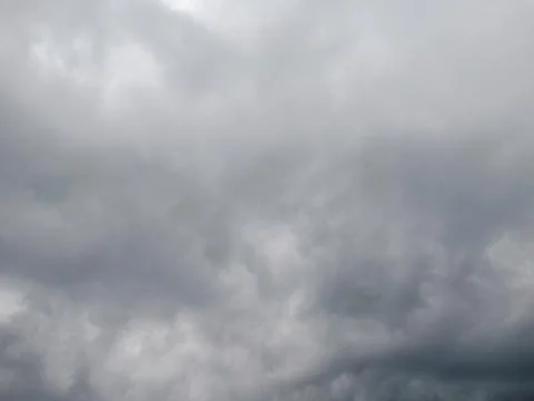 Black clouds hanging in the sky are a sign of overcastity Stock Photos