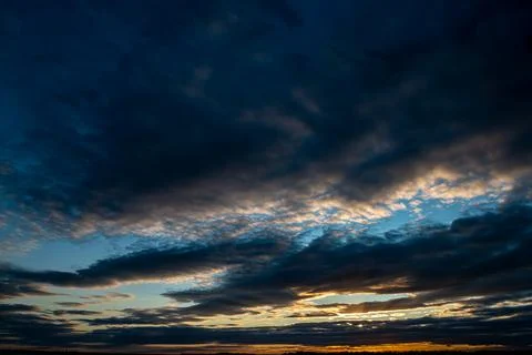 Black clouds in the sky during sunset Stock Photos
