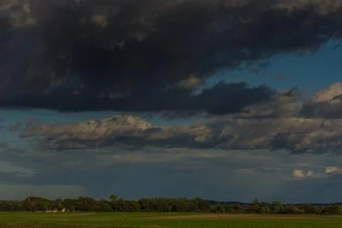 Black clouds in the sky with a landscape Stock Photos