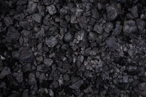 Black coal background top view selective focus Stock Photos