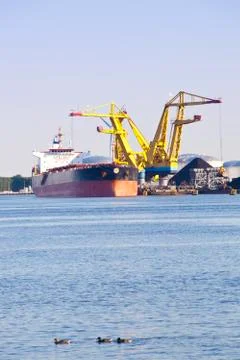 Black coal loading on ship Stock Photos