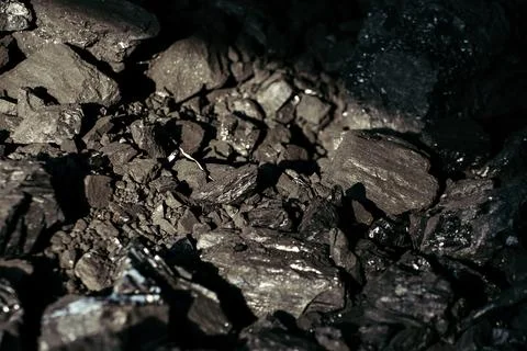 Black coal stones close-up. Solid advertising background. Foto stock