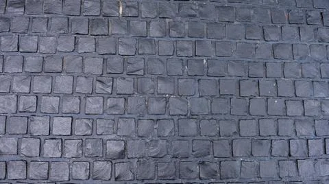 Black cobbled stone road background pavement texture Stock Photos