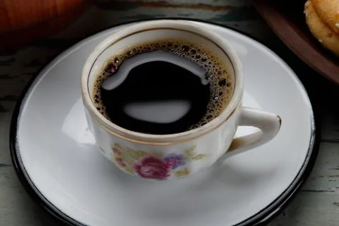 Black coffe cup on the table Stock Photos