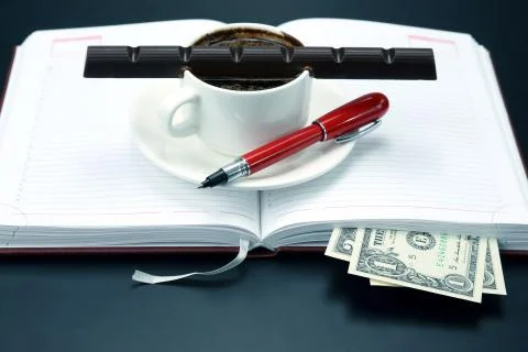 Black coffee and chocolate on the table from a business person Stock Photos