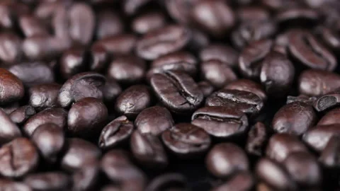 Black coffee beans pattern rotating. Close up macro. Stock Footage 92397103