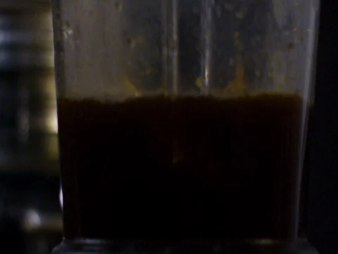 Black coffee being prepared in the machine Stock Footage 83185887