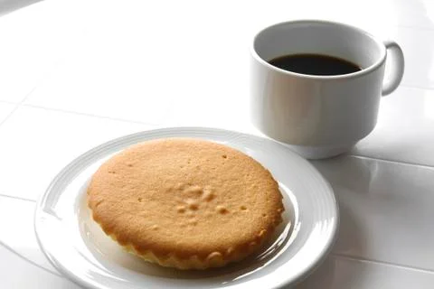 Black coffee with butter cake Stock Photos