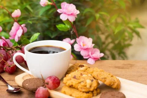 Black coffee with cookie Stock Photos