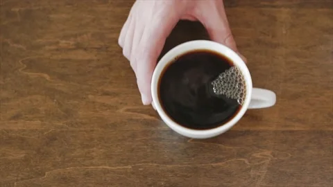 Black coffee in a cup Stock Footage 232870298