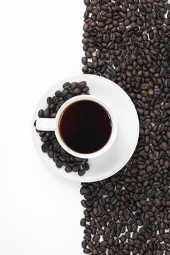 Black Coffee Cup with Roasted Beans Border on White Background Stock Photos