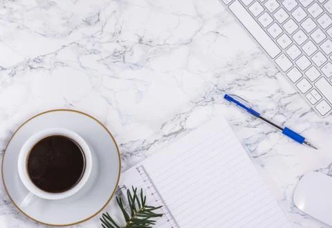 Black coffee on the desk with a computer, mouse Keyboard, book note, and pen  Stock Photos