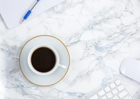 Black coffee on the desk with a computer, mouse Keyboard, book note, and pen  Stock Photos