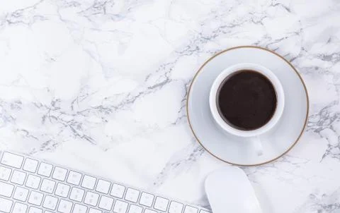 Black coffee on the desk with a computer, mouse Keyboard, book note, and pen  Stock Photos