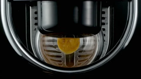 Black coffee machine pouring coffee into the glass cup Stock Footage 133036488