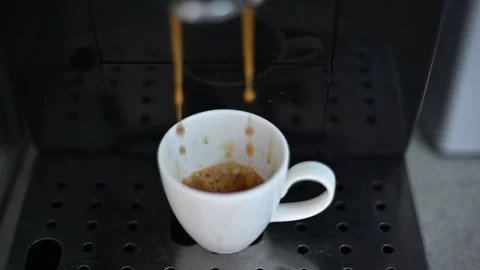 Black coffee machine pouring fresh espresso coffee Stock Footage 201243587