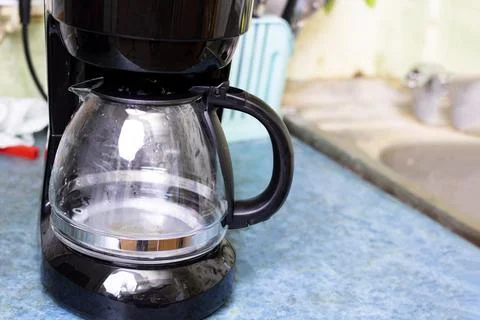 Black coffee maker on the kitchen table Stock Photos