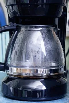 Black coffee maker on the kitchen table Stock Photos
