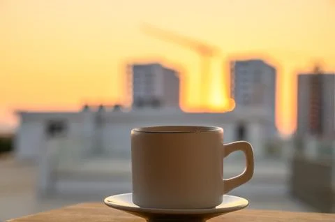 Black coffee in a mug on the background of the pool Stock Photos