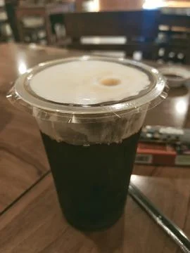 Black coffee in plastic cup Stock Photos