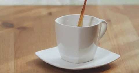 Black coffee is poured into a cup top view. Drink fresh coffee morning at home. Stock Footage 201050840