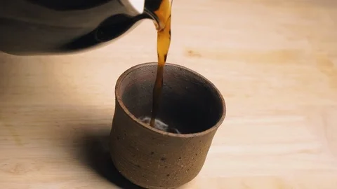 Black Coffee Pouring Into A Cup Stock Footage 127305337