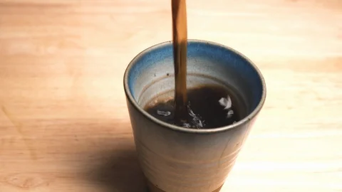 Black Coffee Pouring Into A Cup Stock Footage 127305706